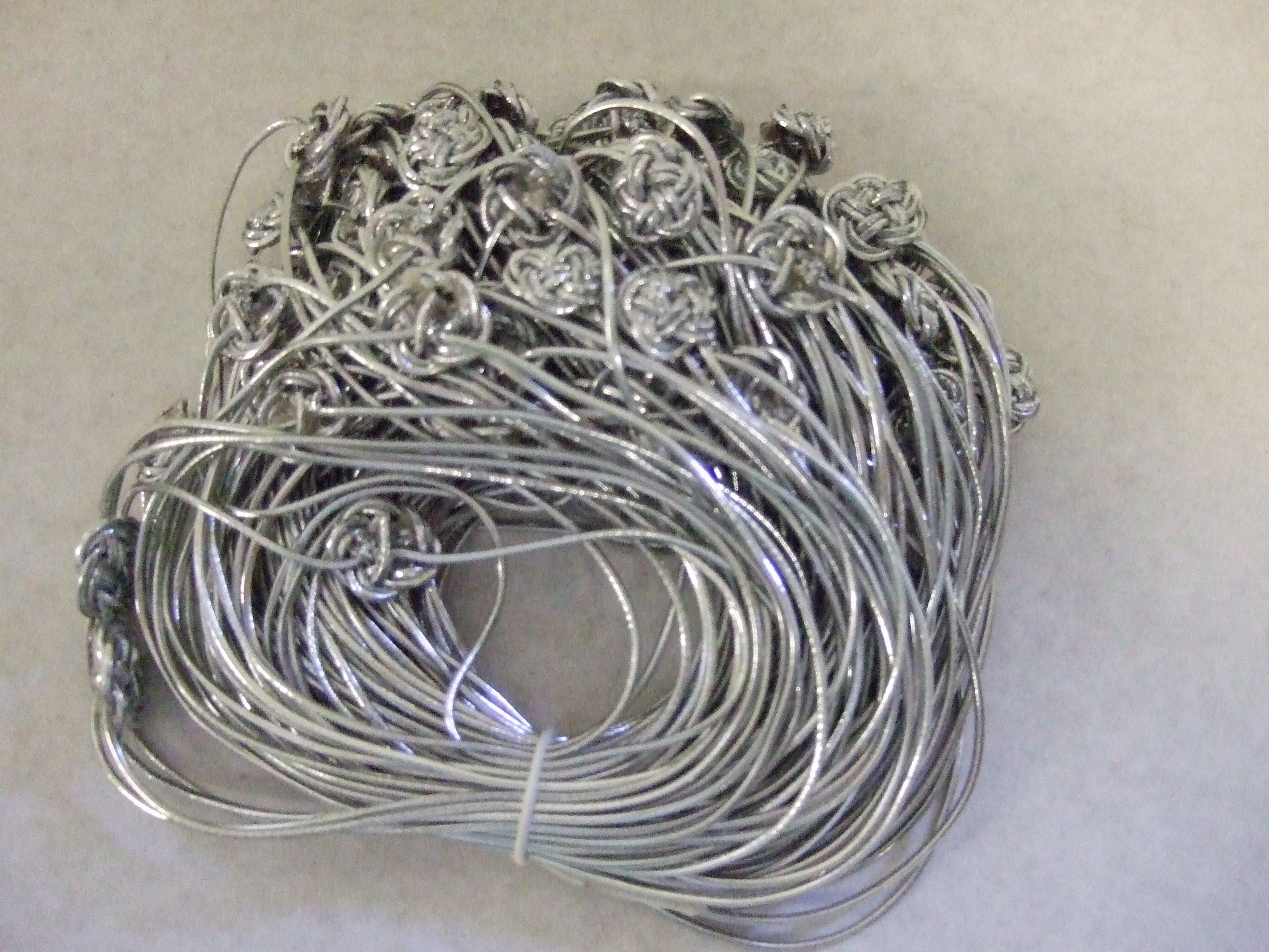 42575-600-100  **ELASTIC LOOP & BUTTON 600MM SILVER