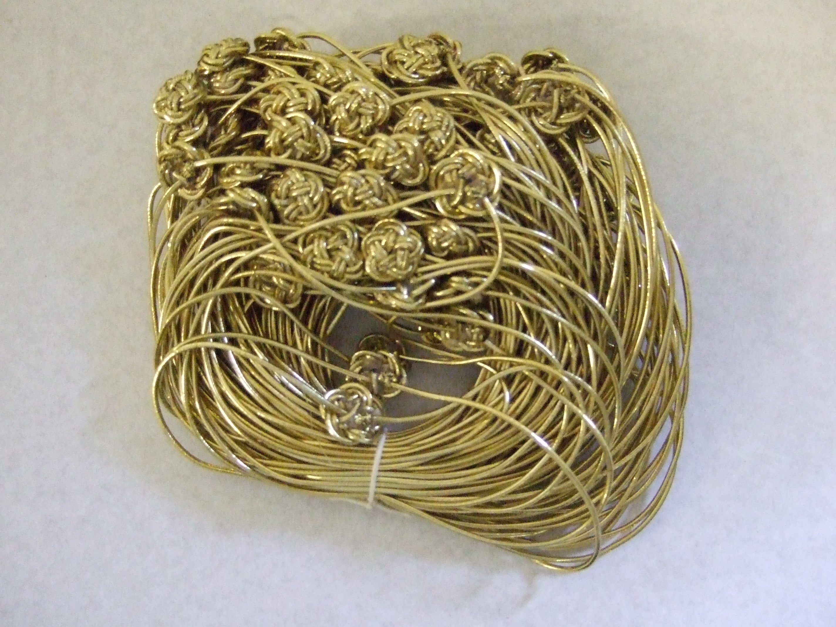 42575-500-200  **ELASTIC LOOP & BUTTON 500MM GOLD